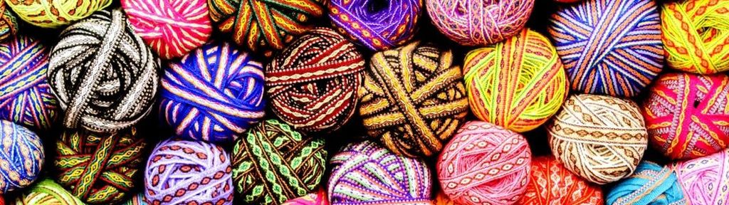A vibrant pile of yarn balls symbolizes new opportunities in retirement.