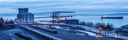 image of infrastructure and ships passing through