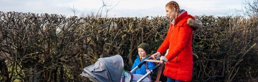 Woman with child and baby in stroller