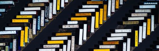 Aerial image of shipping containers parked diagonally.