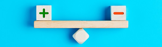 Blocks on a wooden seesaw