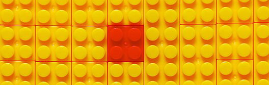 Yellow legos with one red lego