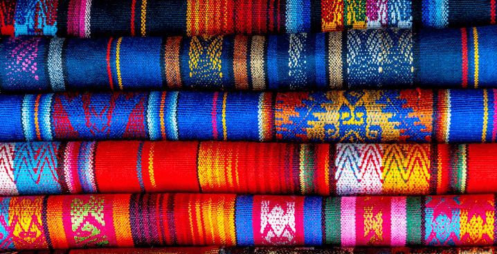 Image of stacks of colorful fabric