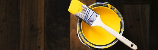 yellow paint and brush