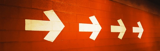 Bright arrows on orange background