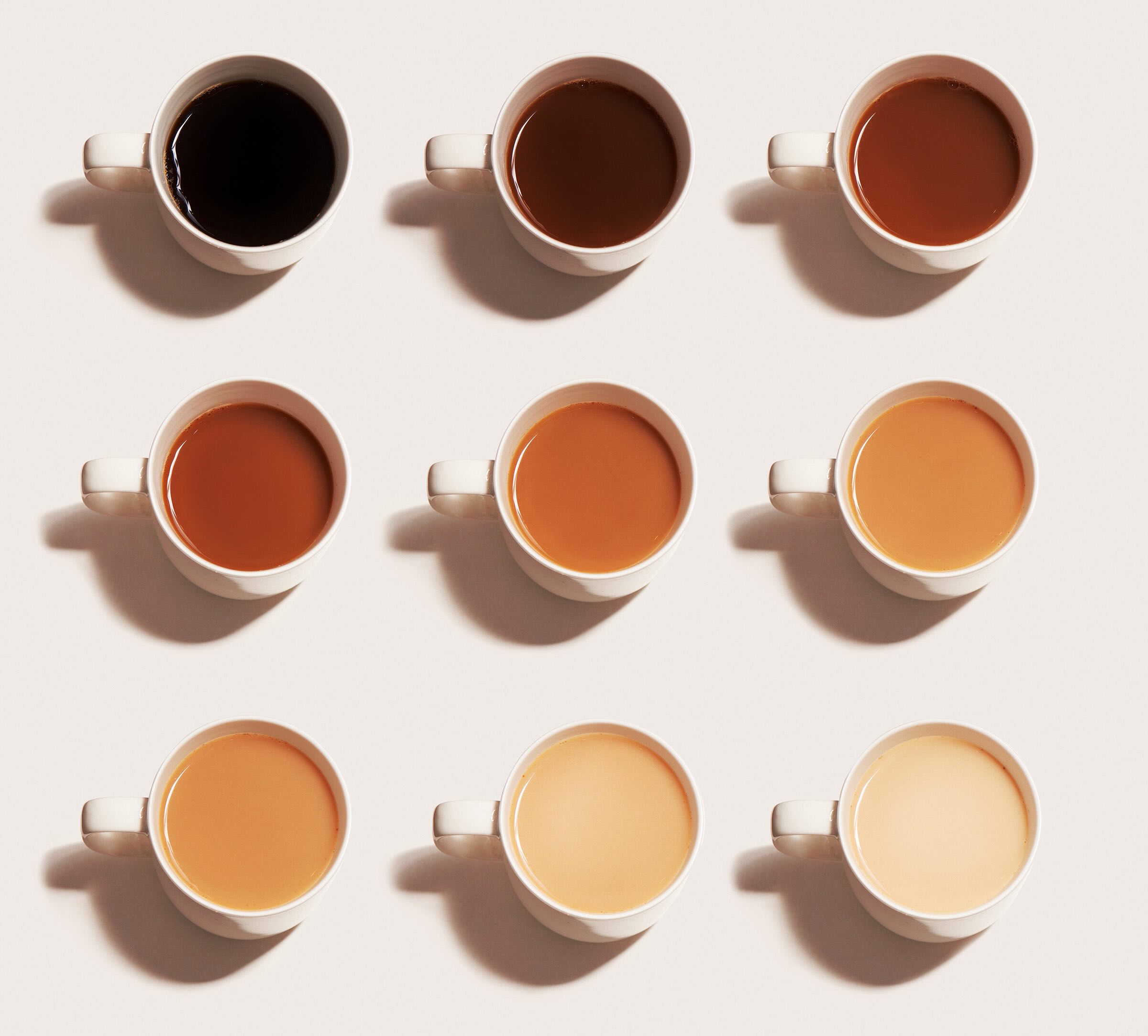 Nine cups of coffee in a gradient of colors from dark to light.