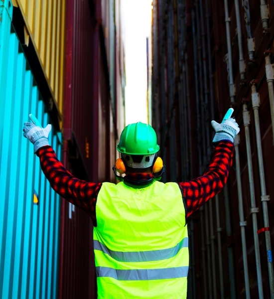 Image of construction worker directing construction