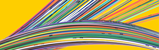 Two bundles of colorful cables going in different directions
