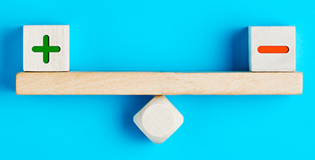 Blocks on a wooden seesaw.