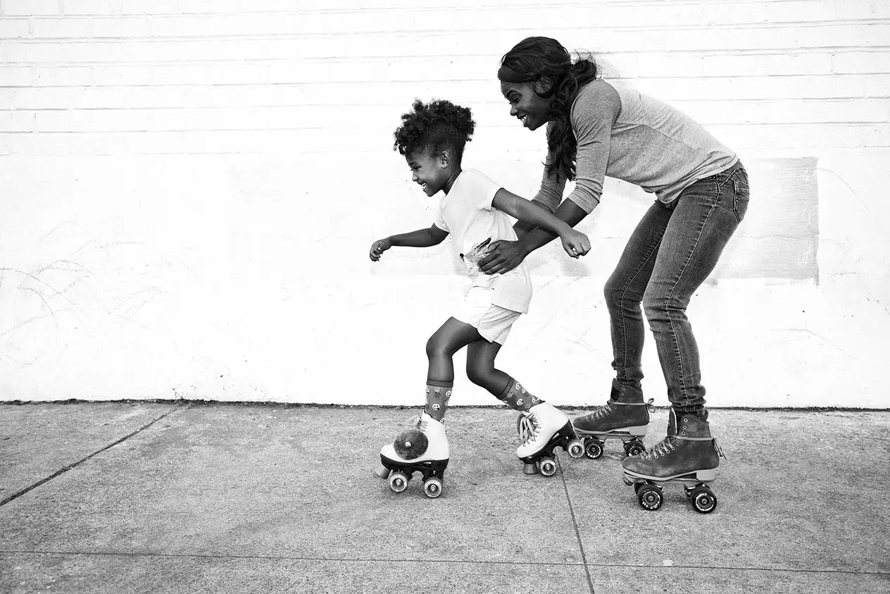 woman and child on rollerskates
