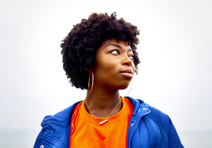 portrait of woman looking off camera with colourful clothing