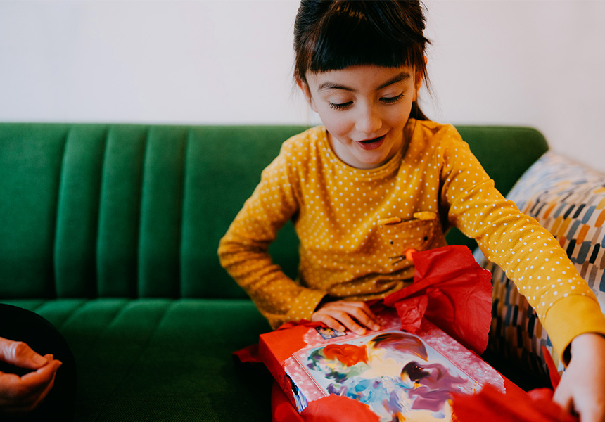  A young girl opens a present