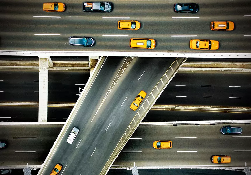 A photo of vehicles driving on an interstate.