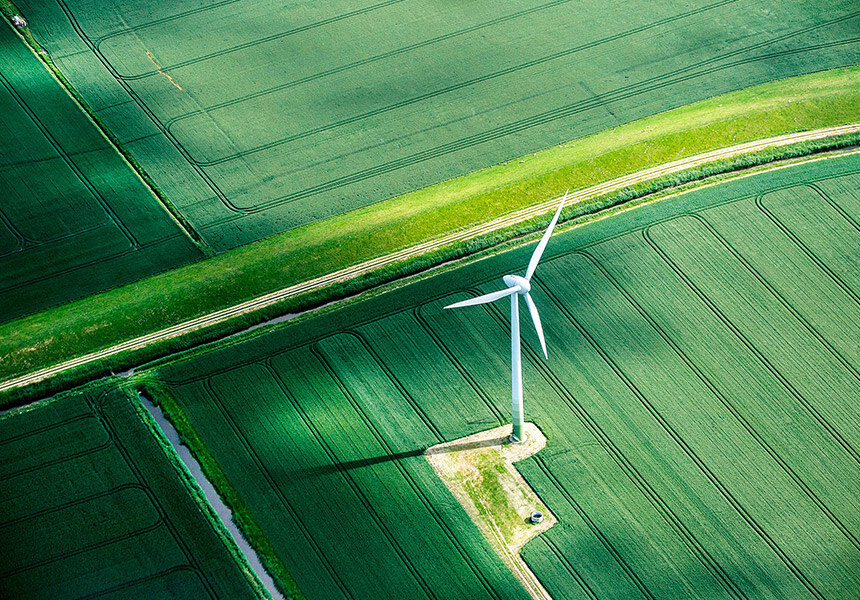 An overhead image of a windmill in a grassy landscape