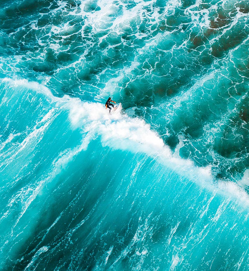 Image of man surfing on ocean wave