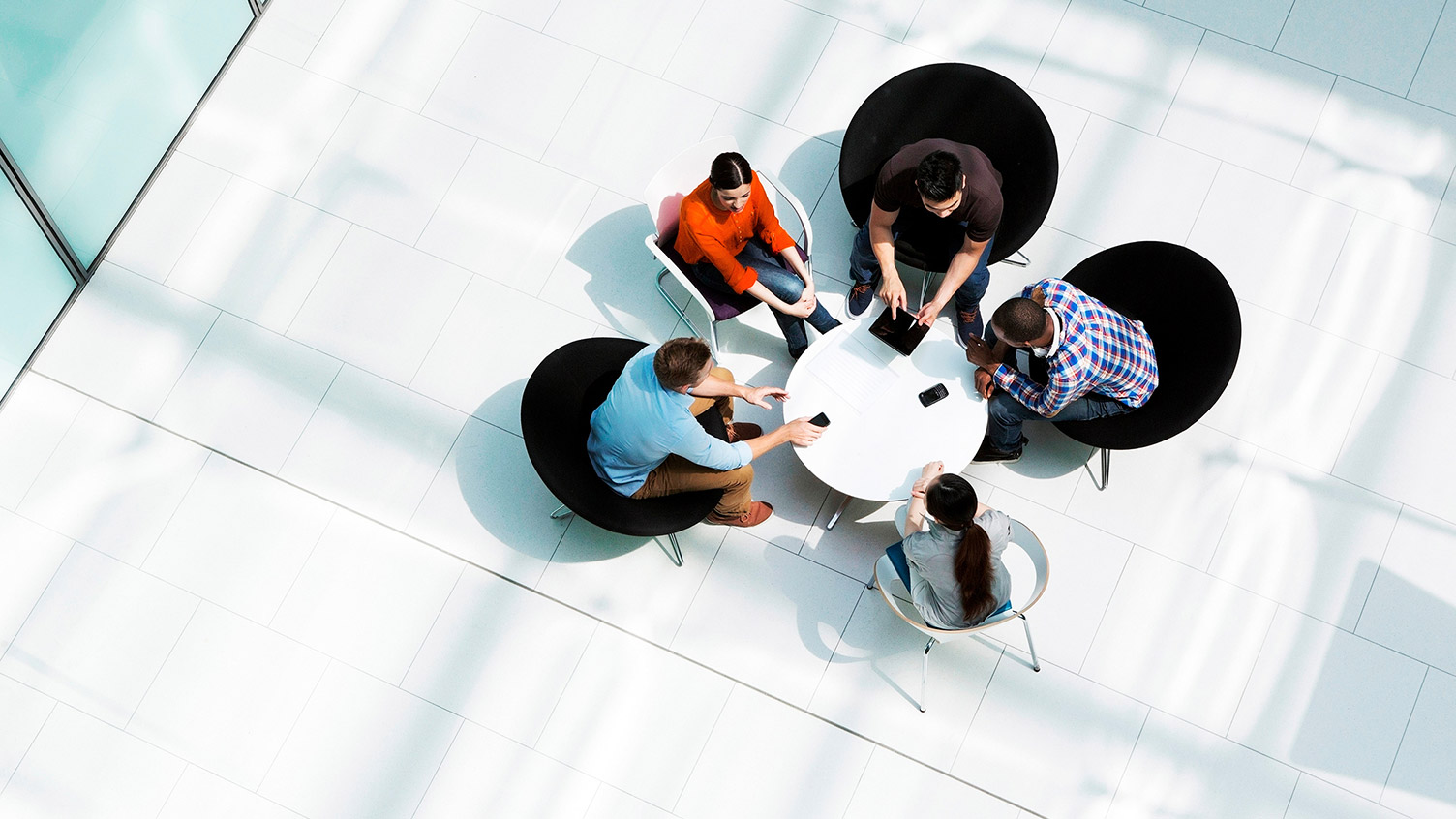 Peers sitting round a table