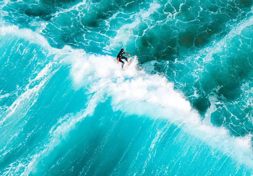 A man surfing the ocean