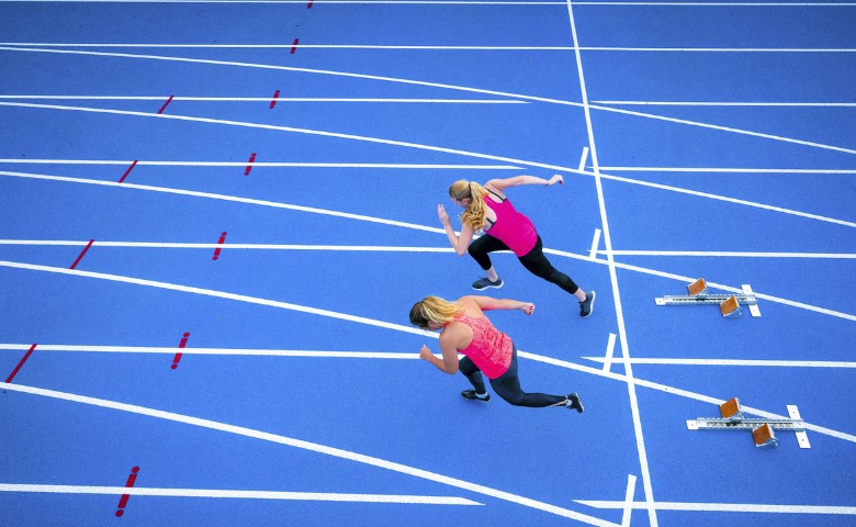 women sprinting on track
