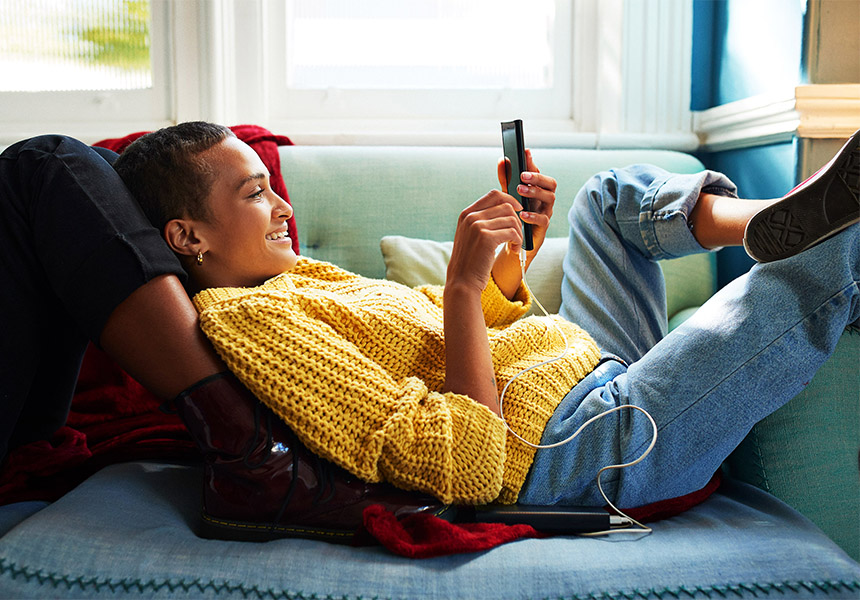 Girl looking at phone and smiling