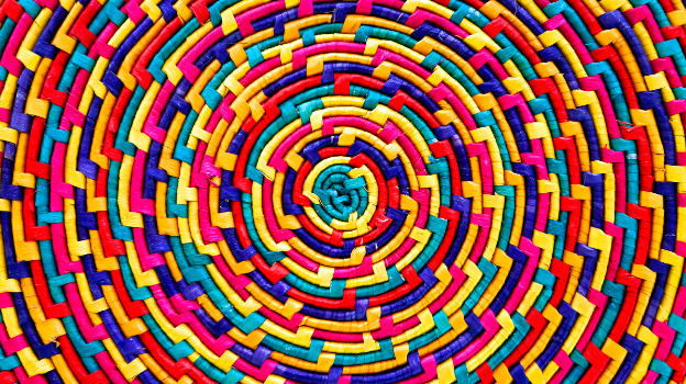 Woven basket pattern featuring colorful concentric circles in yellow, red, blue, green, and purple.