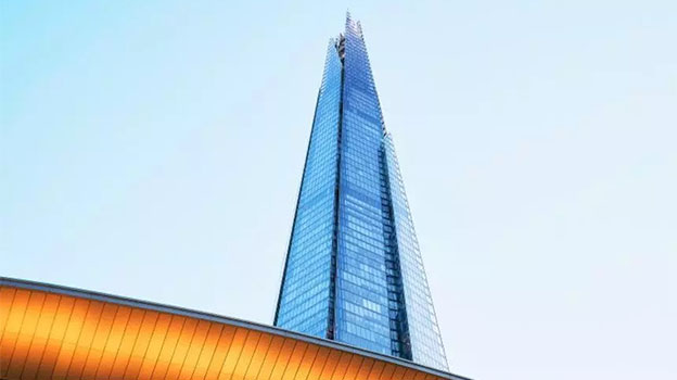 High rise building in front of blue sky without clouds