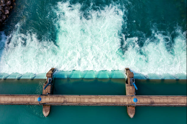 Waves crashing against a dam