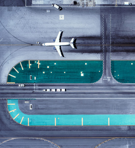 Birds eye view of an airport with a plane