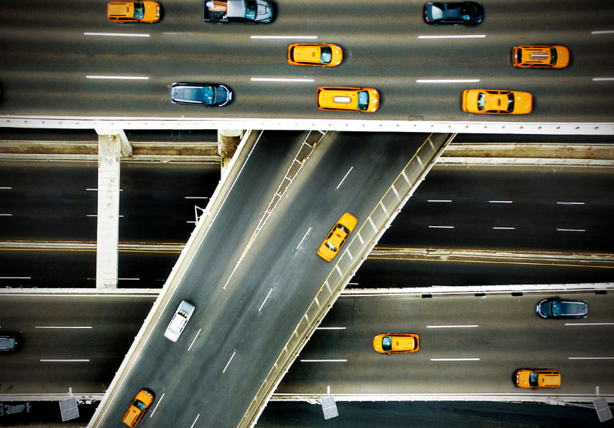 American highway with tens of vehicles crossing over
