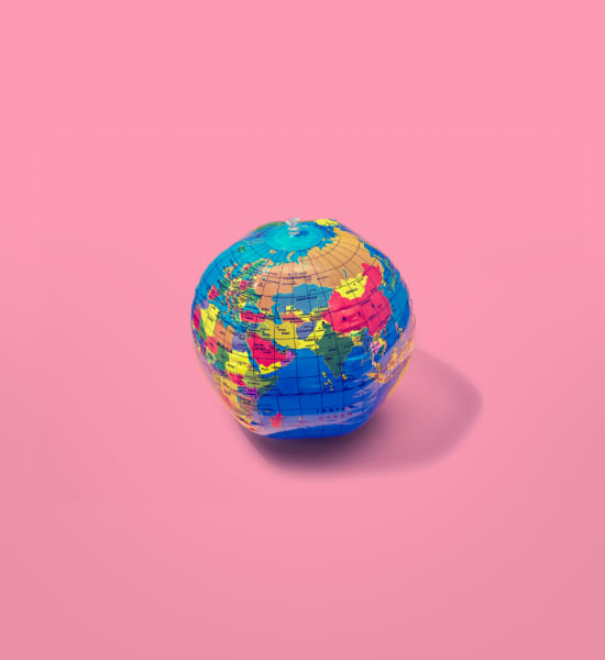 World globe on a pink background