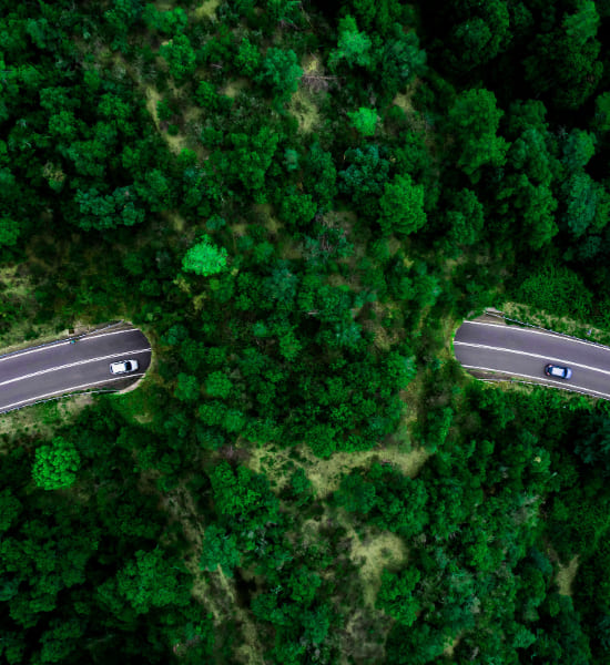 Birds eye view of a road going underground