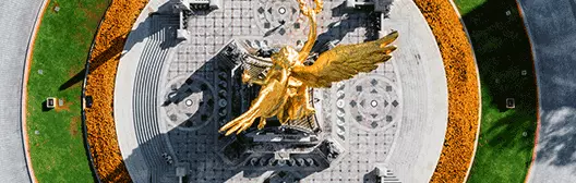 Gold monument in middle of the road