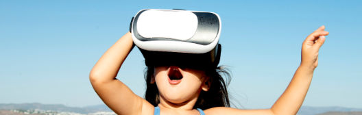 Young child with a VR headset with a surprised mouth open
