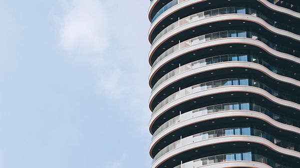 Apartment building set against a blue sky