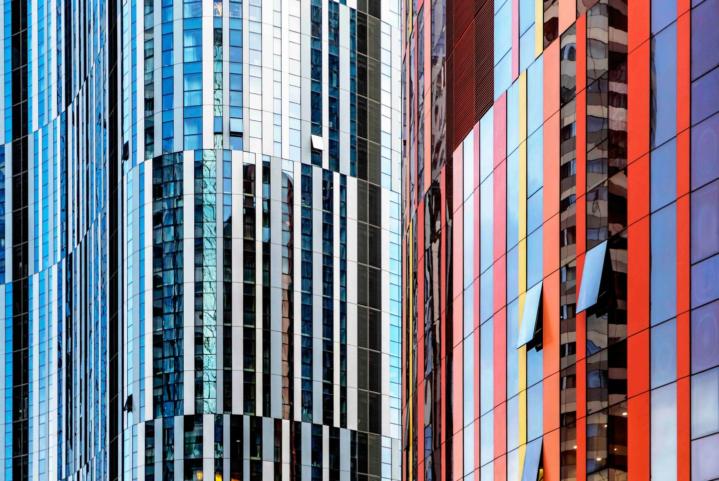 Geometric architectural surface with repeating triangular panels.