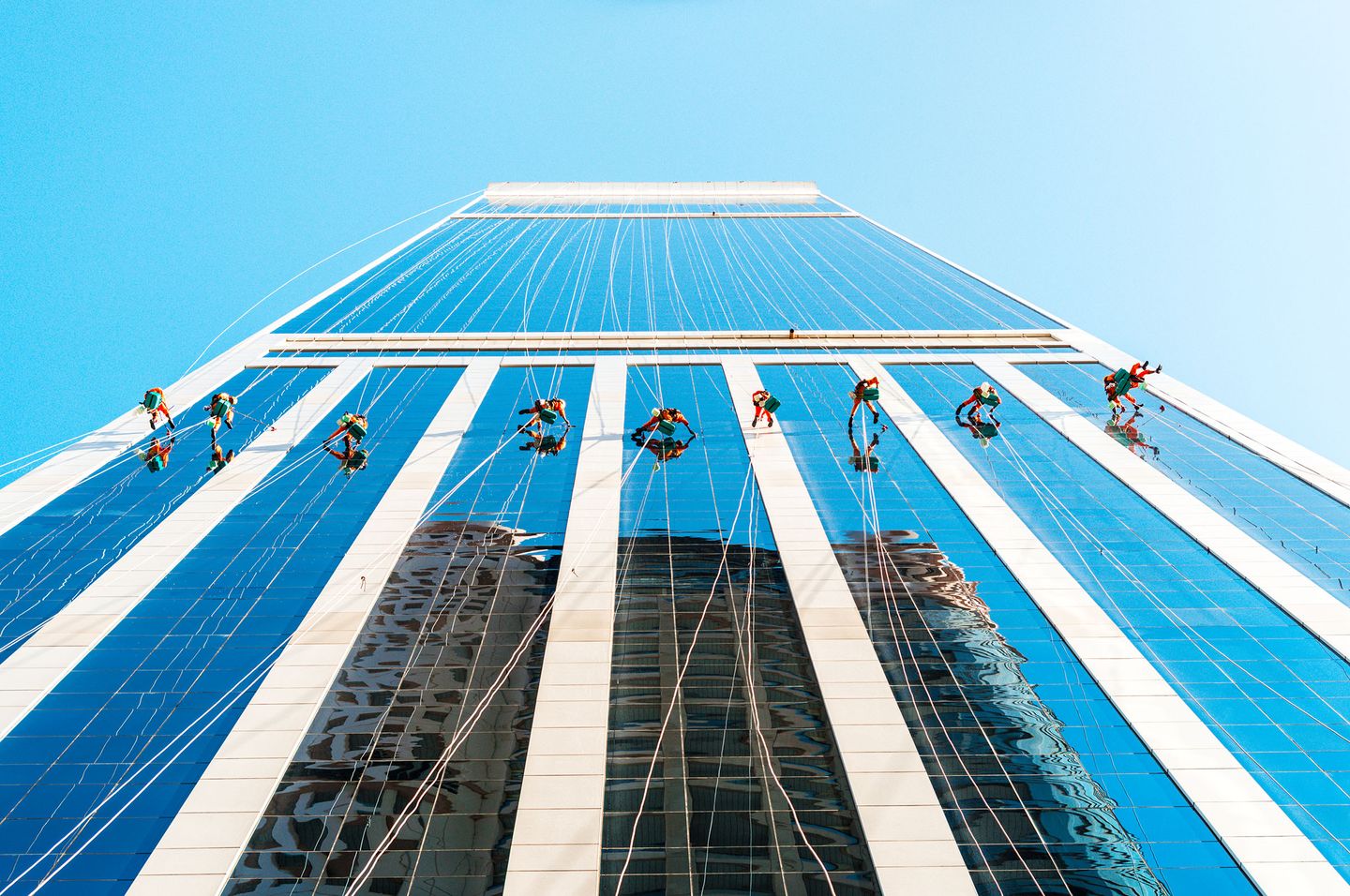 Building Cleaners, People Cleaning the City Building / Dubai, UAE
