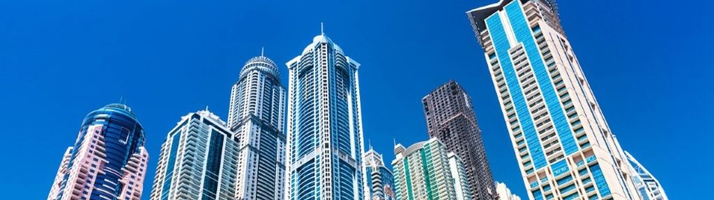 a skyline of buildings that represent what the DOL’s safe harbor proposal could mean for retirement plans