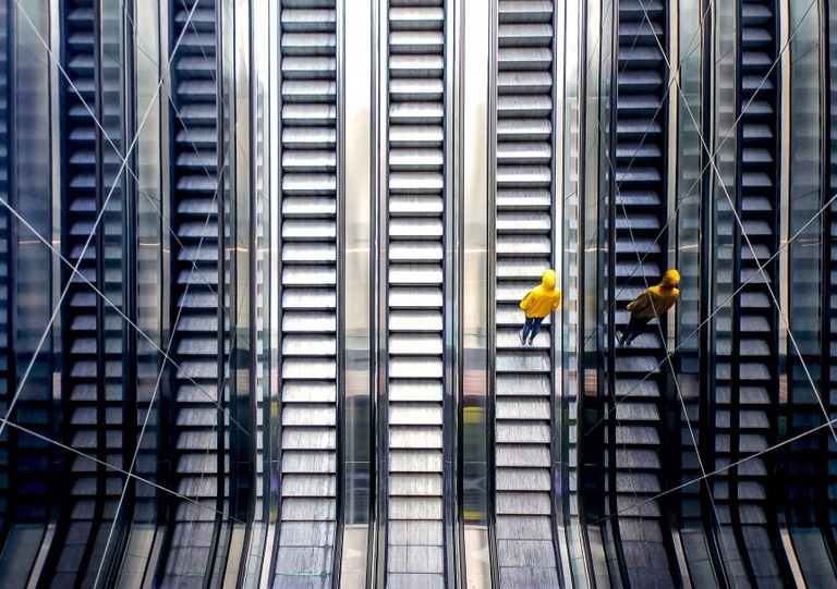 Man on escalator 