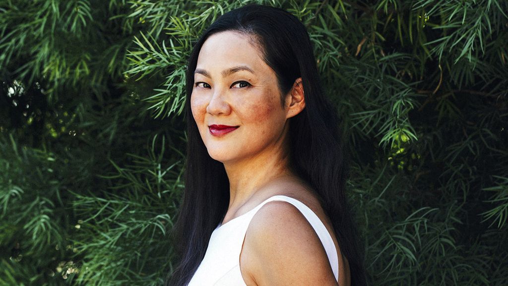 Women's side profile with a soft smile