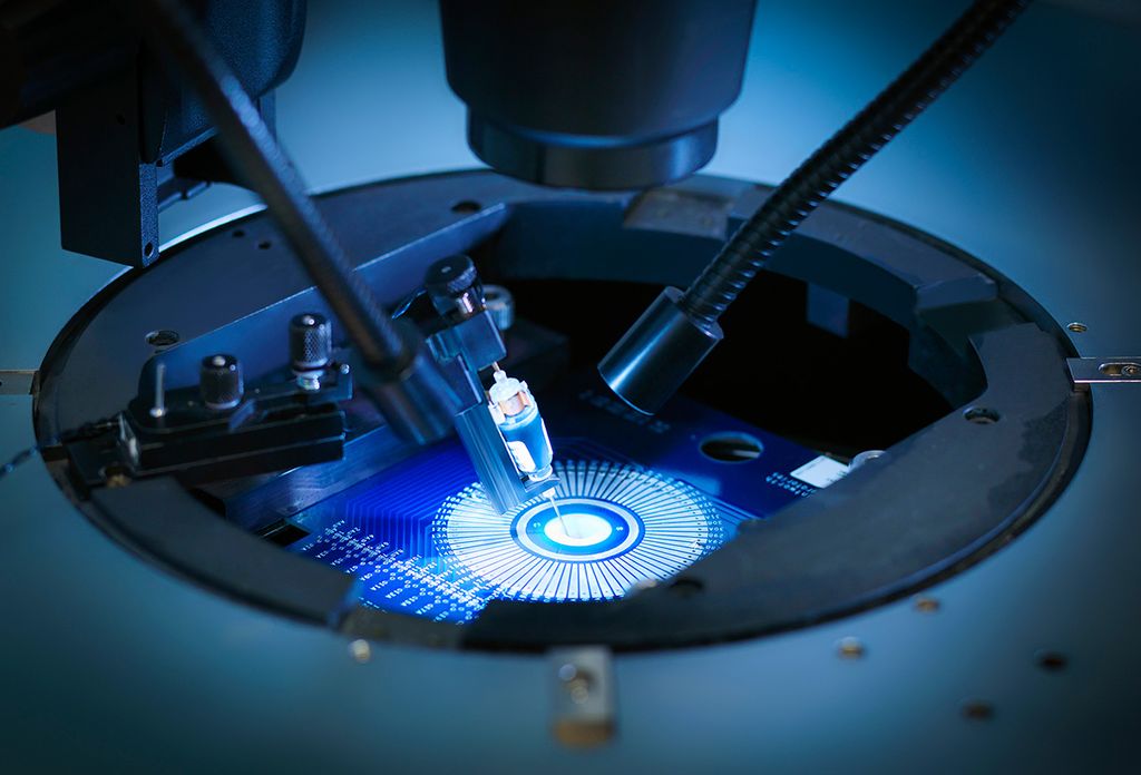 Dark blue image of machine in lab