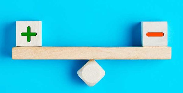 Balance scale with two different shapes against each other