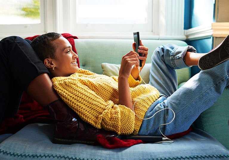 Girl looking at phone and smiling