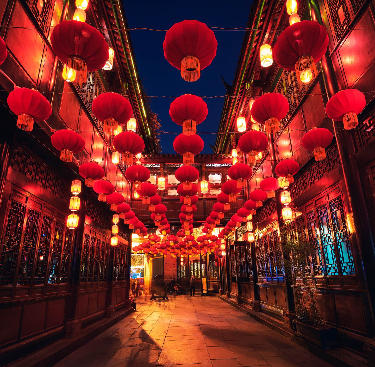 Red lanterns hanging along a street in China.