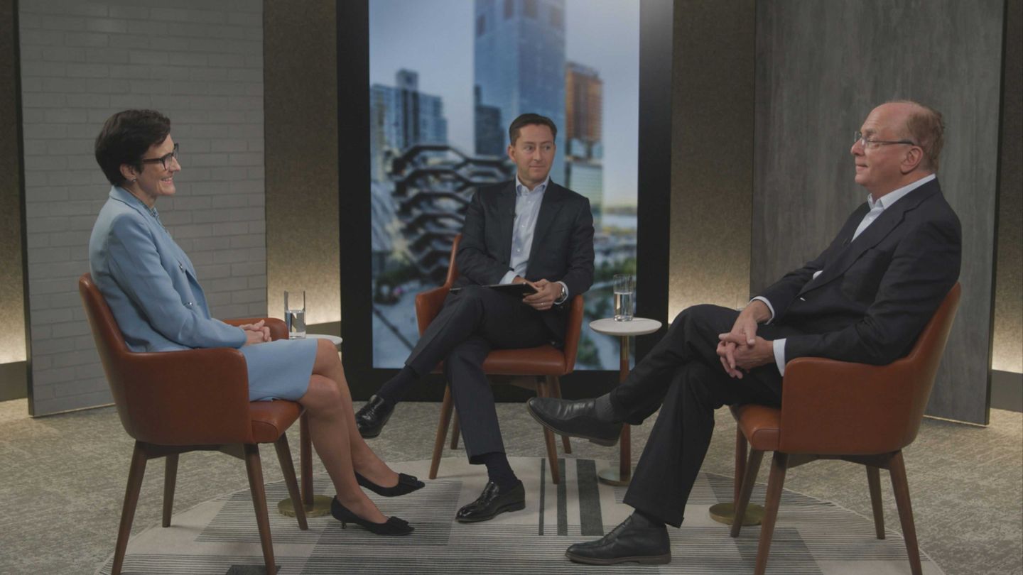 Larry Fink and colleagues in a business meeting
