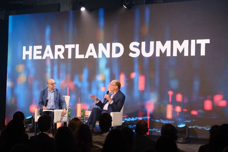 Larry Fink and Mike Allen onstage at the 2026 Heartland Summit