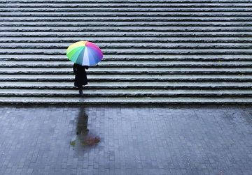 Image with umbrella representing protection against volatility