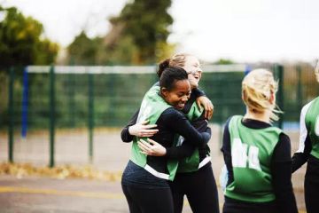 team hugging each other